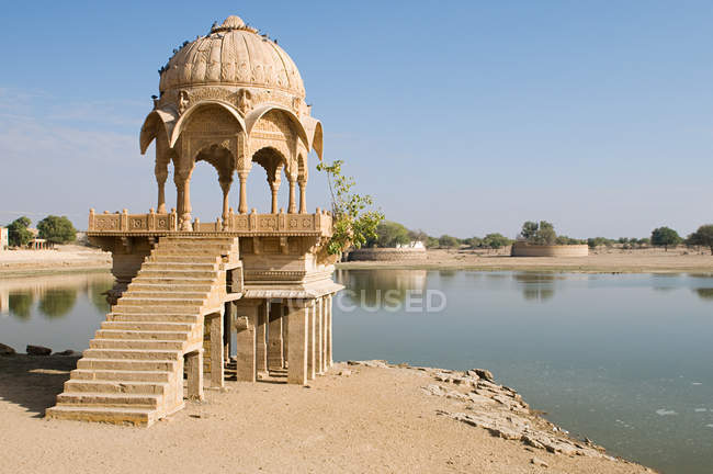Stone tower by gadi sagar lake — Stock Photo