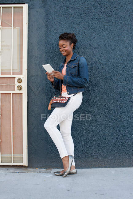 Young woman reading electronic book — Stock Photo