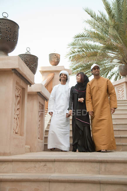 Middle Eastern people walking down steps — Stock Photo