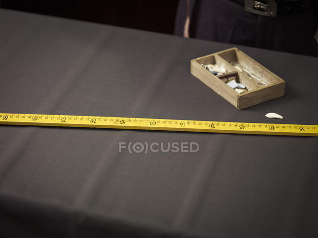 Still life of chalk and ruler in traditional tailors shop — Stock Photo