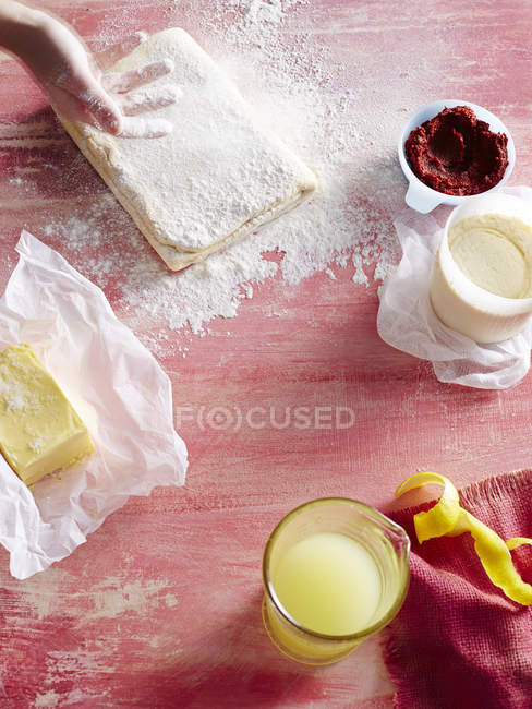 Cropped image of woman preparing pastry at kitchen — Stock Photo