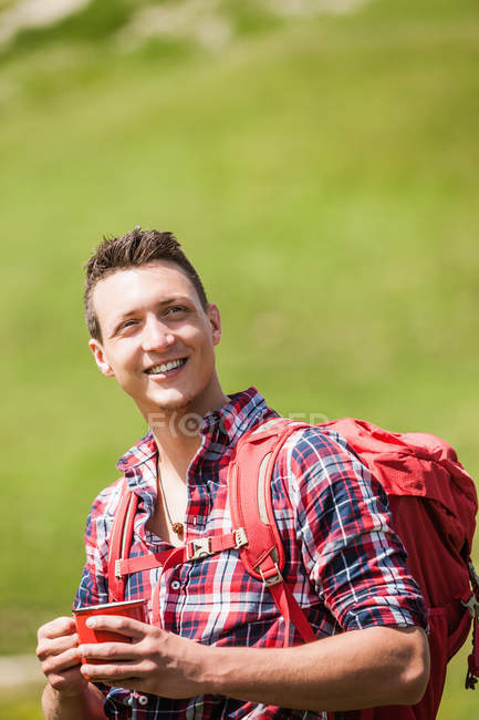 Portrait of young man with backpack — Stock Photo