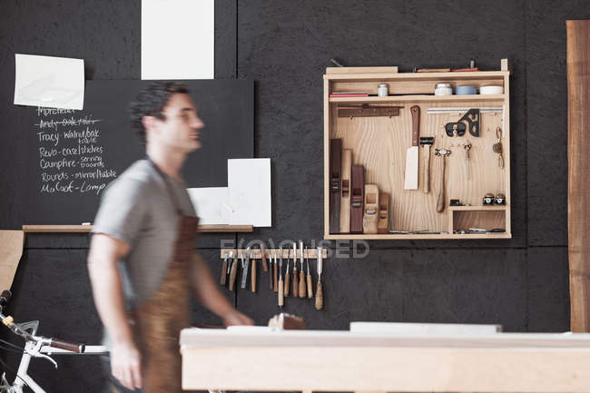Carpenter at his workshop — Stock Photo
