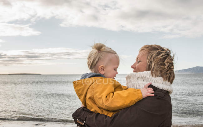 Portrait of woman holding toddler — Stock Photo