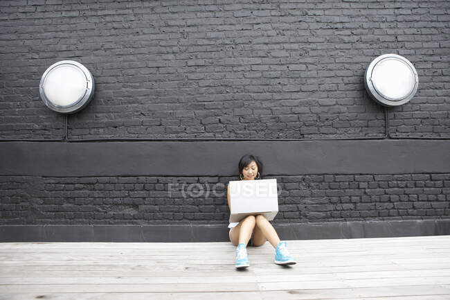 Girl with a computer — Stock Photo