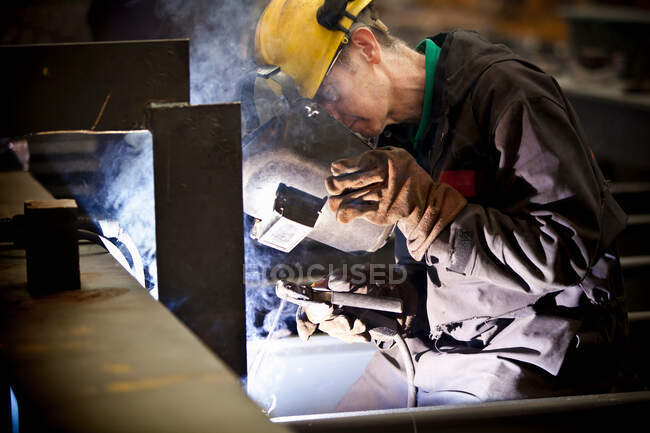 Welders at work in shipyard — Stock Photo