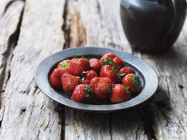 Strawberries in metal bowl, close up shot — Stock Photo