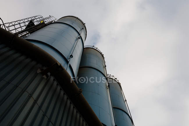 Bottom view of Oil refinery at daytime — Stock Photo