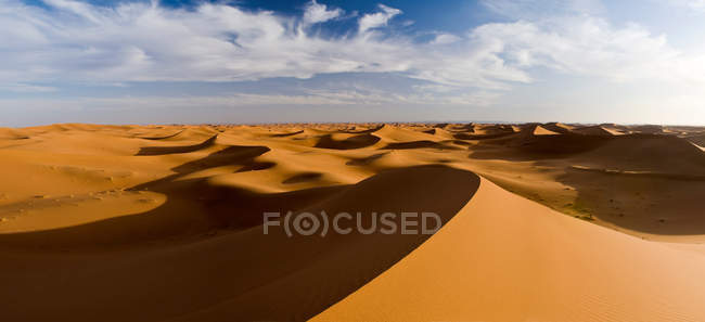 Shadows on sand dunes — Stock Photo