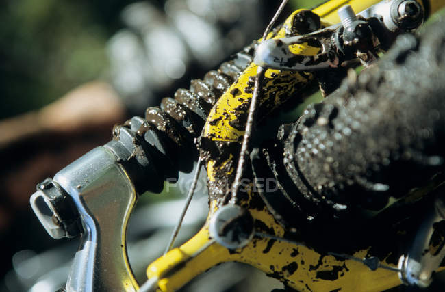 Close-up of mountain bike wheel and shock-absorber — Stock Photo