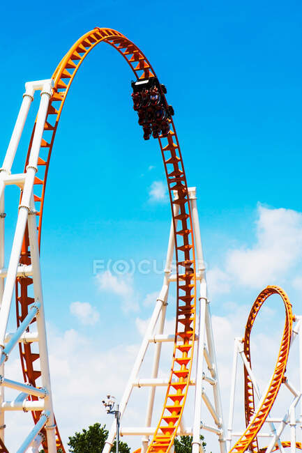 Low angle view of looped roller coaster at Coney Island amusement park, New York, USA — Stock Photo