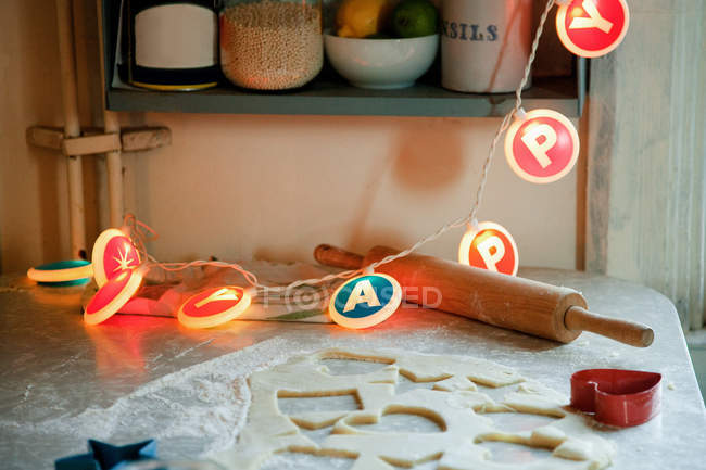 Birthday lights on kitchen table — Stock Photo