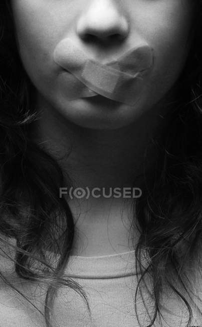 Close up of Woman with bandage over mouth — Stock Photo