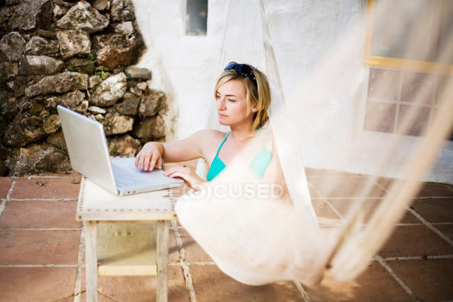 A woman in a hammock — Stock Photo