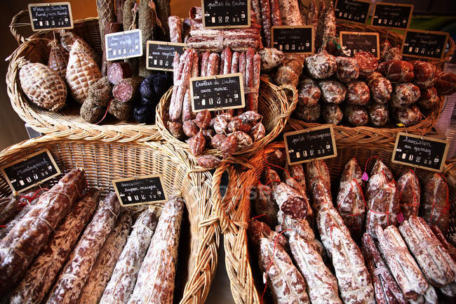 Charcuterie with price tags in street market — Stock Photo