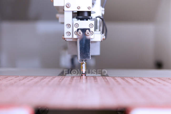 Machine cutting flexible circuits — Stock Photo