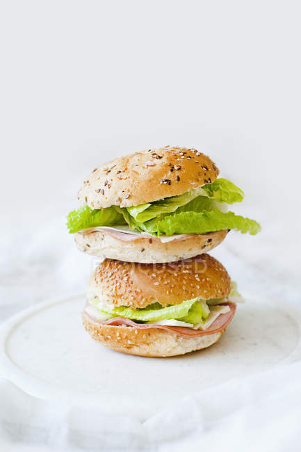 Buns with lettuce and ham slices — Stock Photo