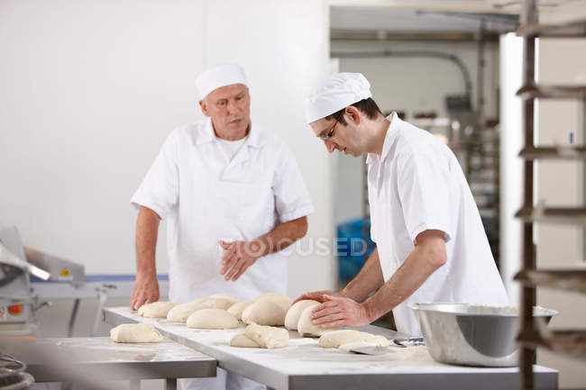 Chefs baking in kitchen — Stock Photo