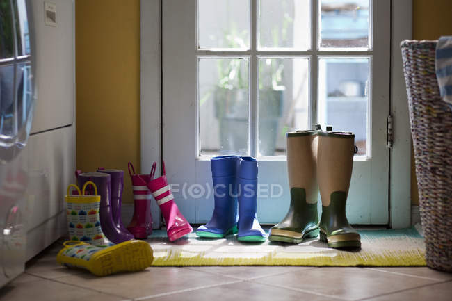 Row of rubber boots — Stock Photo