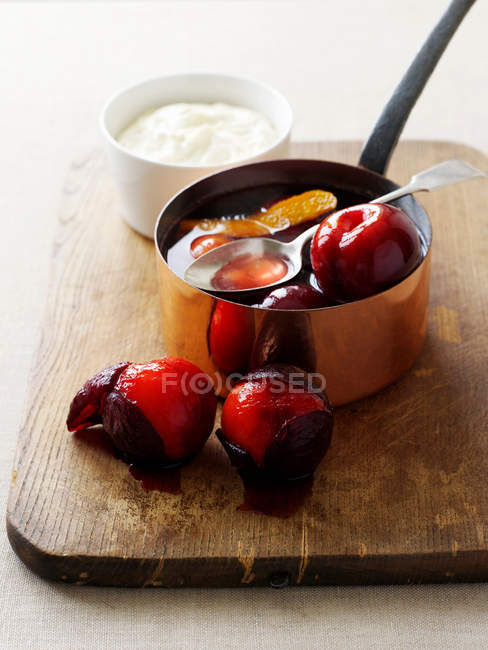 Pot of stewed plums — Stock Photo