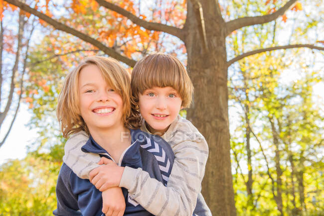 Portrait of two brothers in forest — Stock Photo