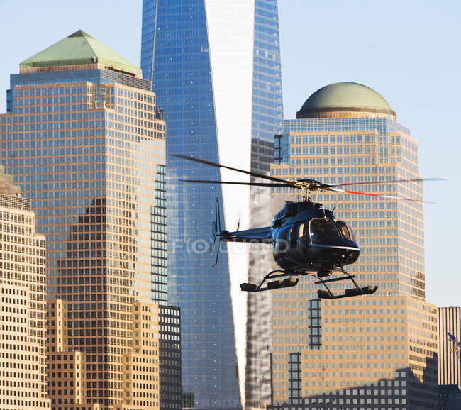 Helicopter and office buildings, New York, USA — Stock Photo