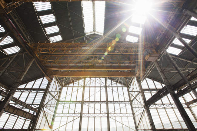 Shipyard building roof and gantry in sunlight — Stock Photo