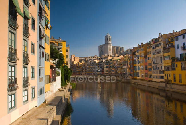Urban buildings reflected in canal — Stock Photo