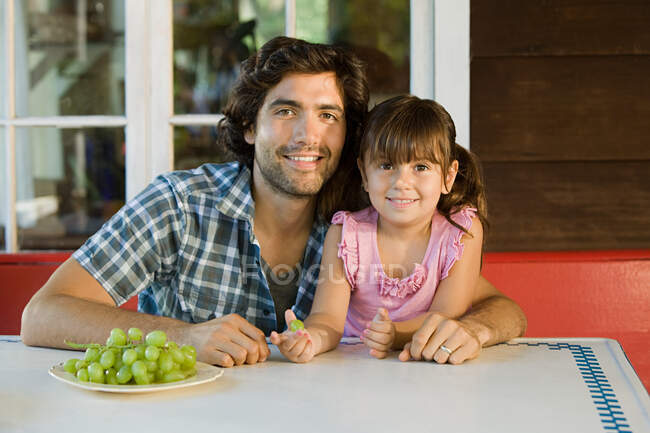 Father and daughter looking at camera — Stock Photo