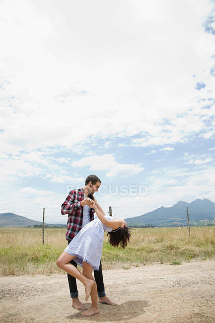 Couple dancing in remote setting — Stock Photo