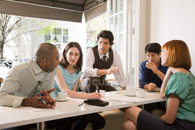 Colleagues meeting in a cafe — Stock Photo