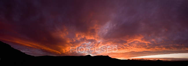 Silhouette of mountains with clouds — Stock Photo