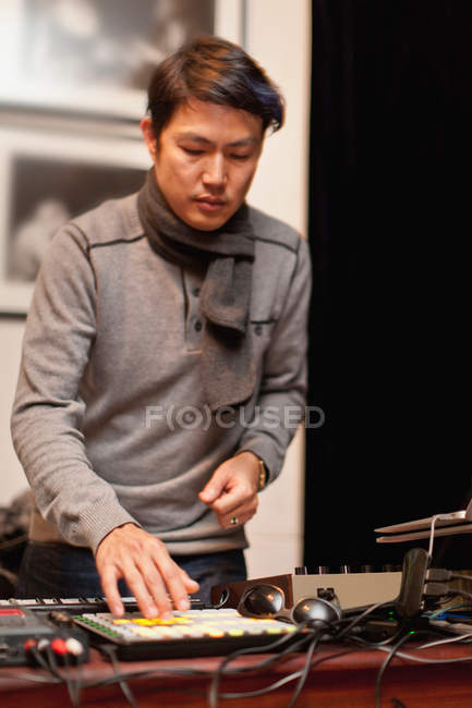 Musician playing with synthesizer — Stock Photo