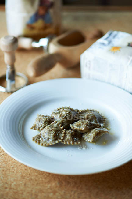 Blue plate of ravioli — Stock Photo