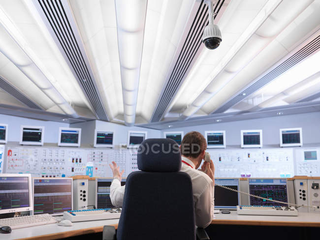 Back view of Operator in control room — Stock Photo