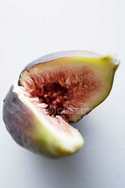 Close up shot of sliced fig on white background — Stock Photo