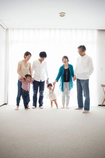 Three generation family holding hands, portrait — Stock Photo