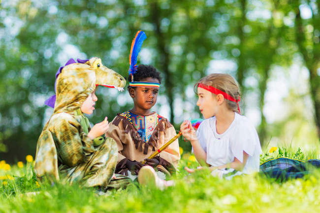Boys playing dress up outdoors — Stock Photo