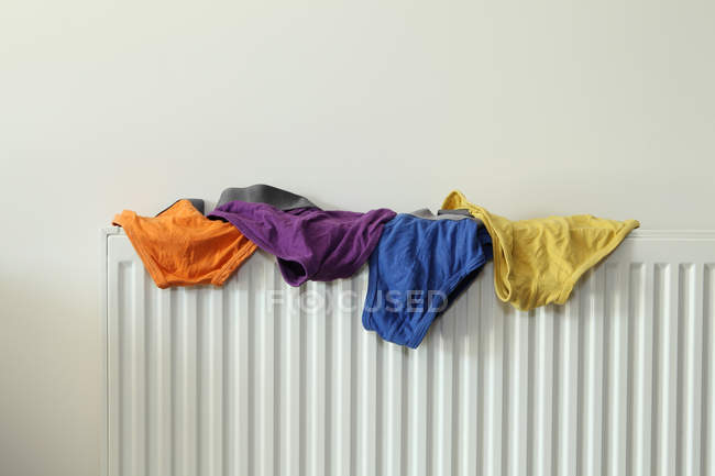 Underwear drying on radiator — Stock Photo