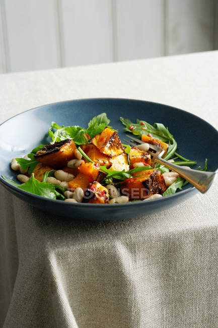 Fish salad with beans in bowl — Stock Photo