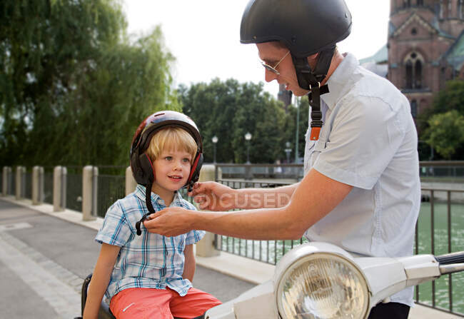 Father and son on scooter — Stock Photo