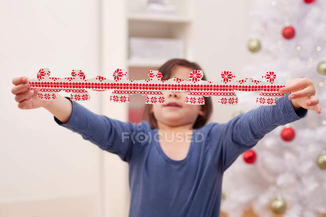 Girl holding Christmas decoration — Stock Photo