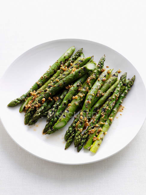 Plate of fried asparagus — Stock Photo