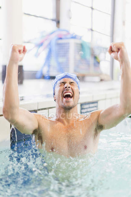 Swimmer cheering in pool, selective focus — Stock Photo