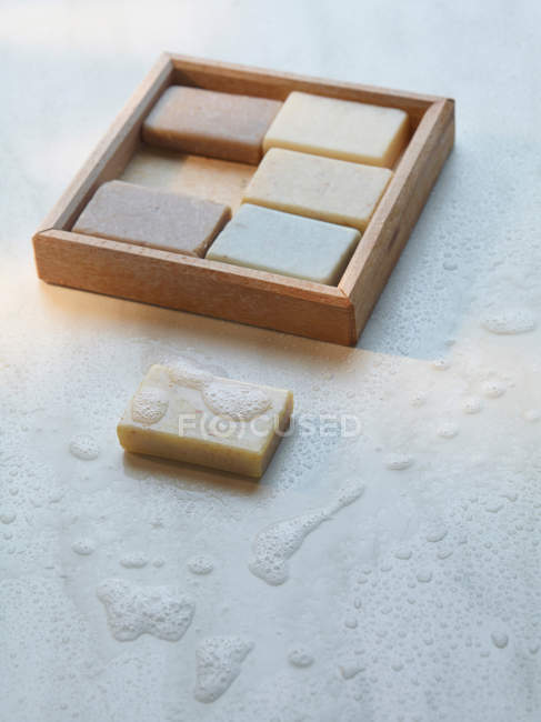 Still life of wooden box of soaps — Stock Photo