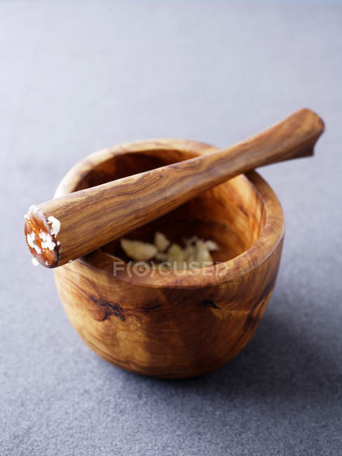 Wooden pestle and mortar — Stock Photo