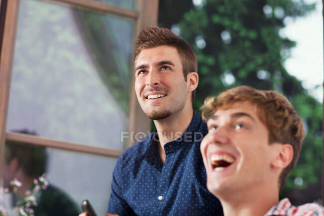 Two young men laughing — Stock Photo