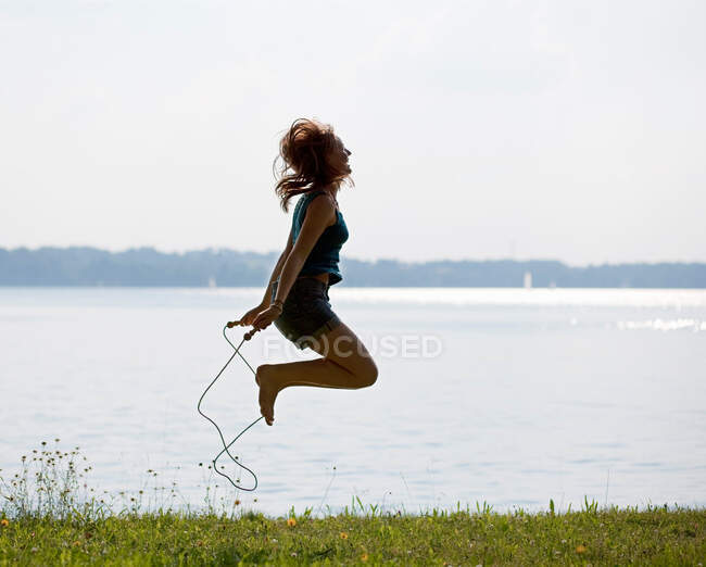Girl jumping with rope — Stock Photo
