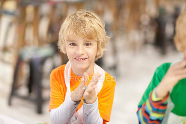 Boy using modelling clay — Stock Photo