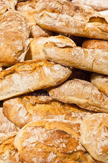 Pile of crusty bread loaves — Stock Photo